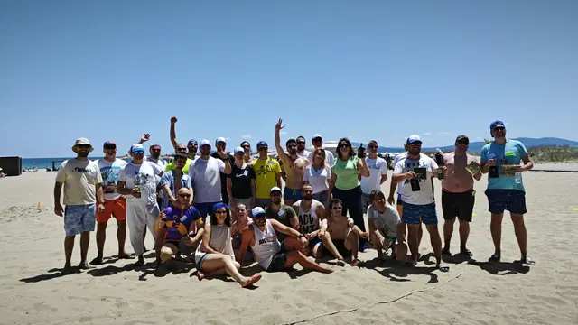 The team gathered on a sandy beach